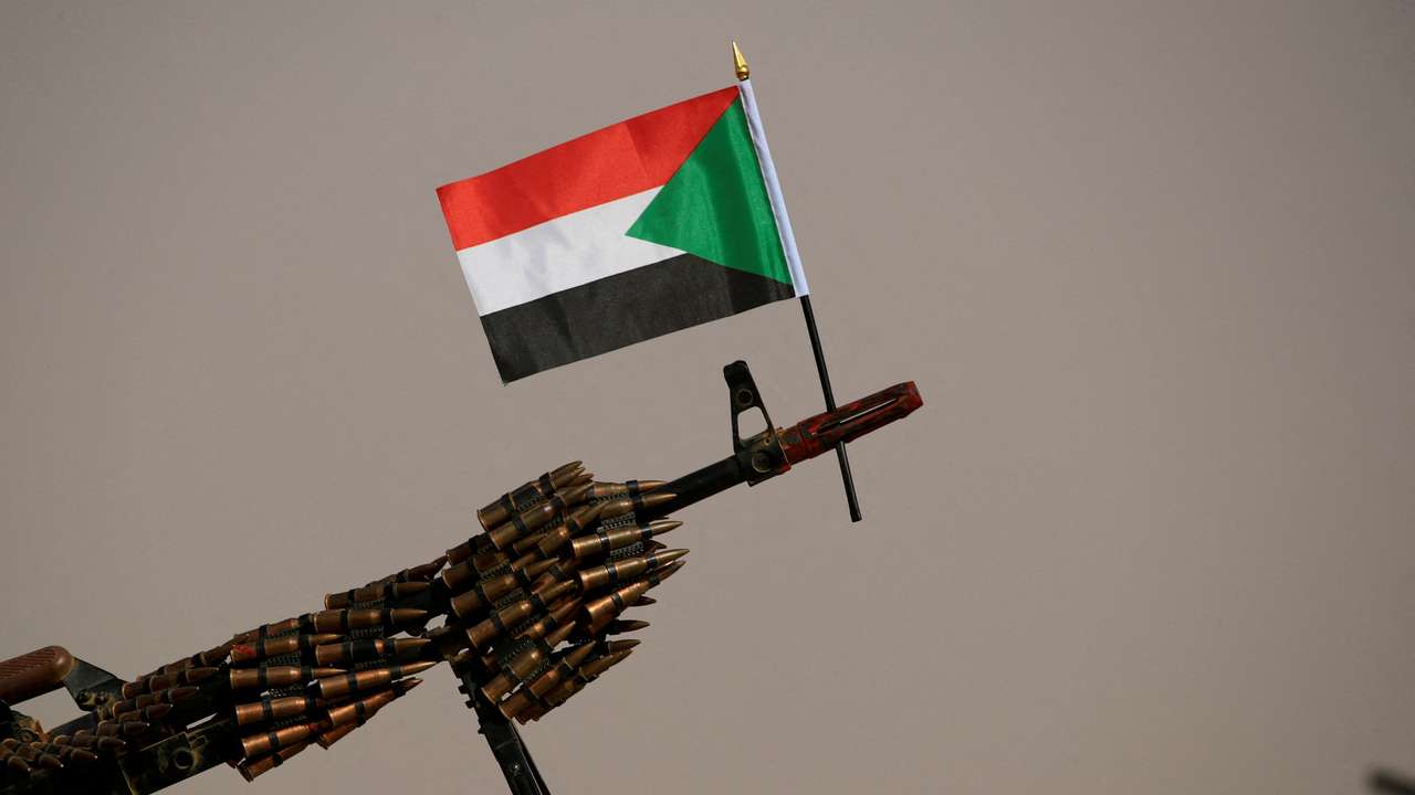 A Sudanese national flag is attached to a machine gun of Paramilitary Rapid Support Forces (RSF) soldiers in Aprag village 60, kilometers away from Khartoum, Sudan