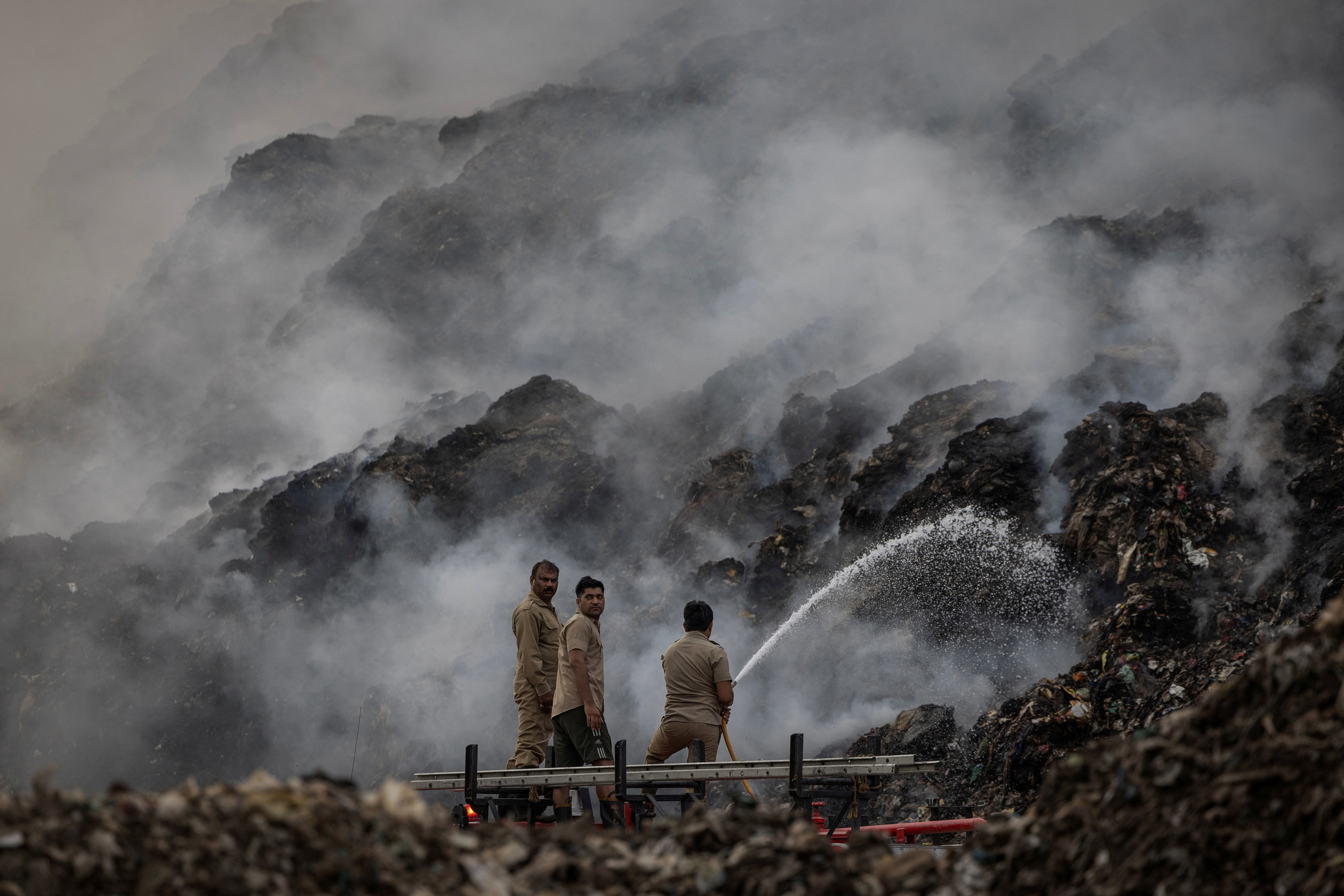 The Wider Image: Record heat, surging fires push Delhi's firefighters to the brink