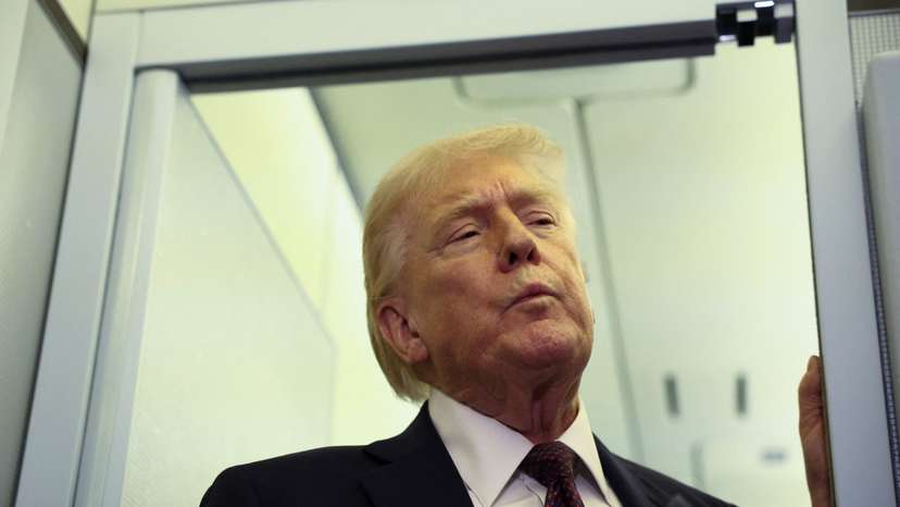 Trump speaks to reporters aboard Air Force One
