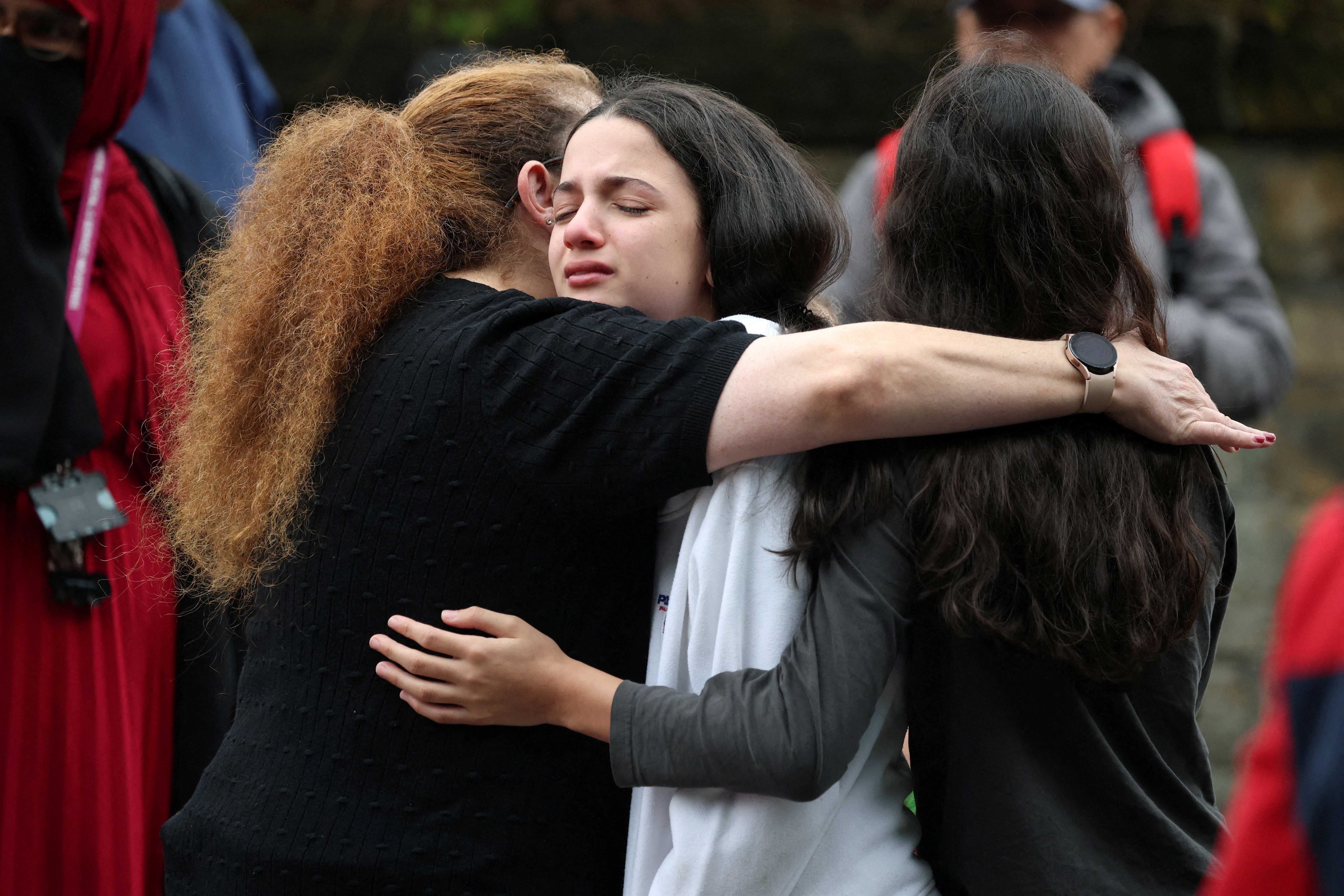 People near the scene following an incident outside a synagogue, in Manchester