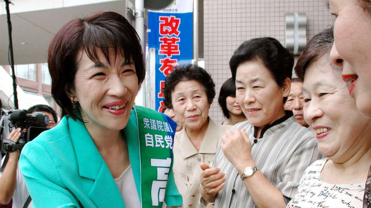 FILE PHOTO: Sanae Takaichi shakes hands with supporters as the official campaign for the lower house elections kicks off, in Ikoma