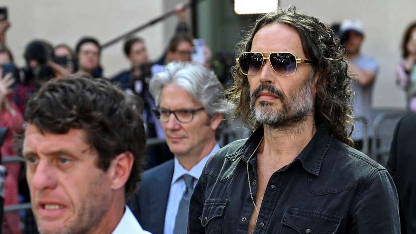 British actor and comedian Russell Brand leaves Westminster Magistrates' Court, in London