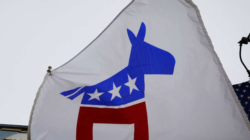 A flag with a logo of the Democratic Party flies in Racine