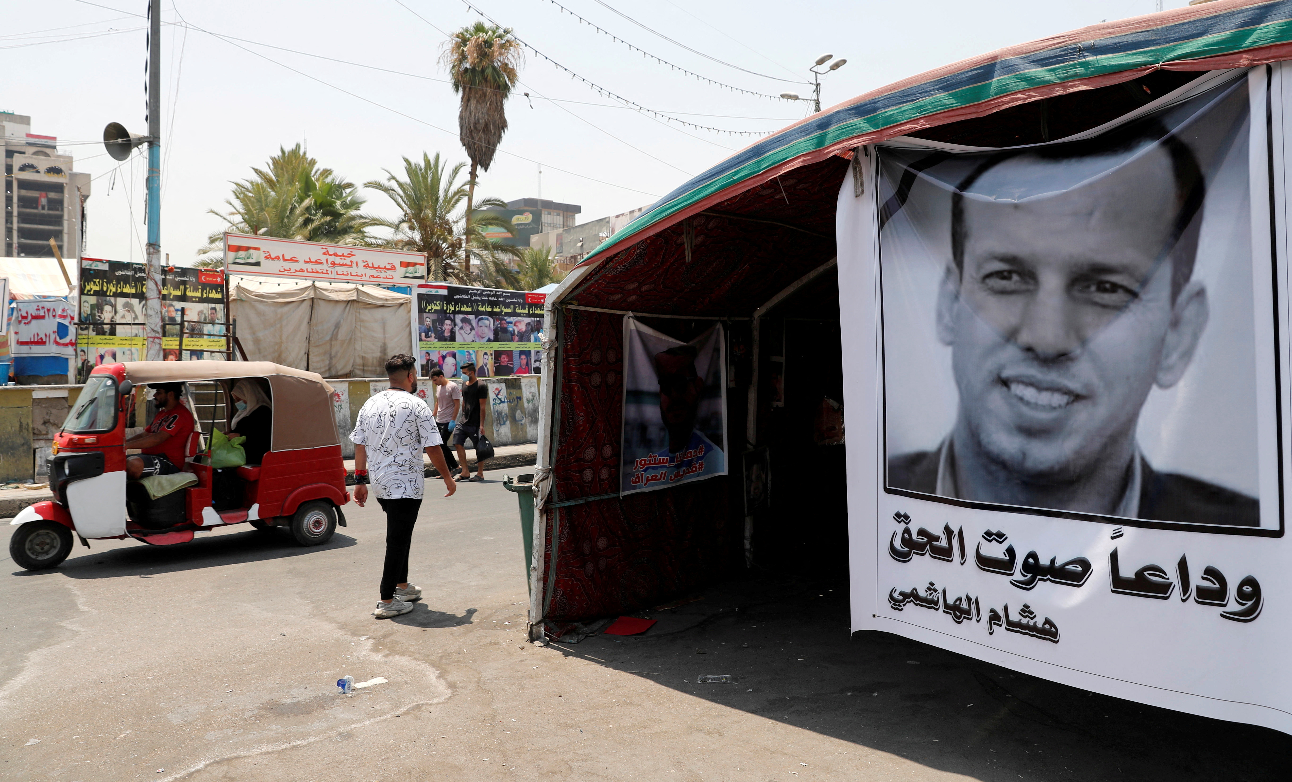 FILE PHOTO: A poster depicting the former government advisor and political analyst Hisham al-Hashemi, who was killed by gunmen is seen at the Tahrir Square in Baghdad