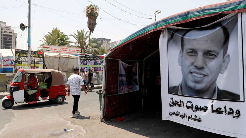 FILE PHOTO: A poster depicting the former government advisor and political analyst Hisham al-Hashemi, who was killed by gunmen is seen at the Tahrir Square in Baghdad