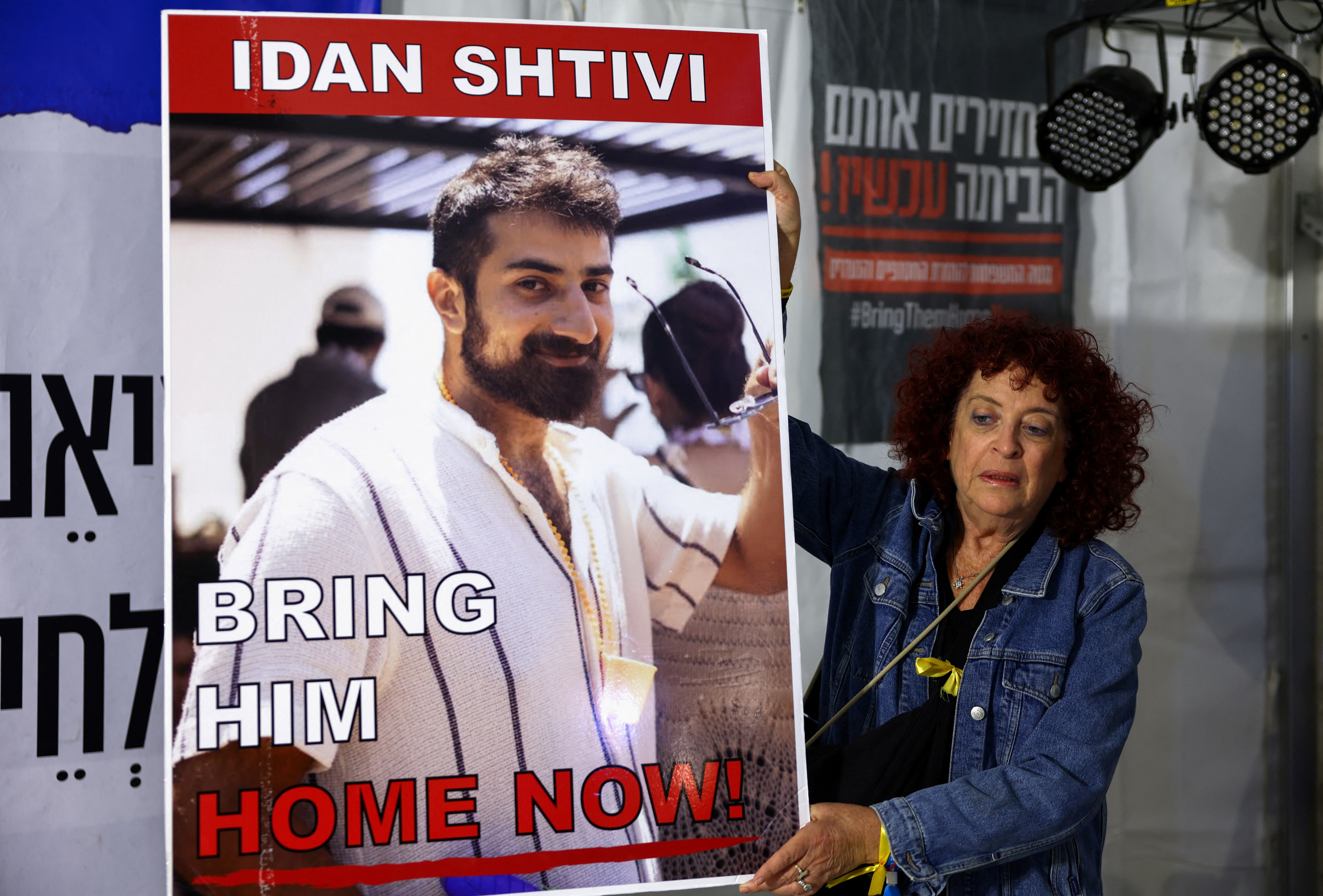 People gather as hostages are released by Hamas, in Tel Aviv