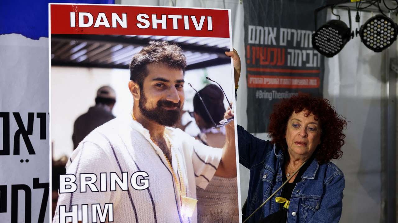 People gather as hostages are released by Hamas, in Tel Aviv