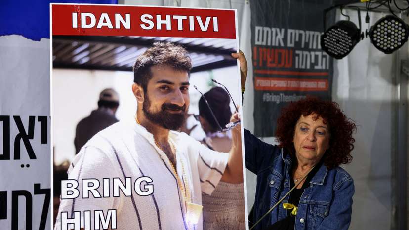 People gather as hostages are released by Hamas, in Tel Aviv