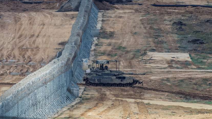 An Israeli Merkava tank manoeuvres near the Israel-Gaza border, amid the temporary truce between Hamas and Israel, as seen from southern Israel