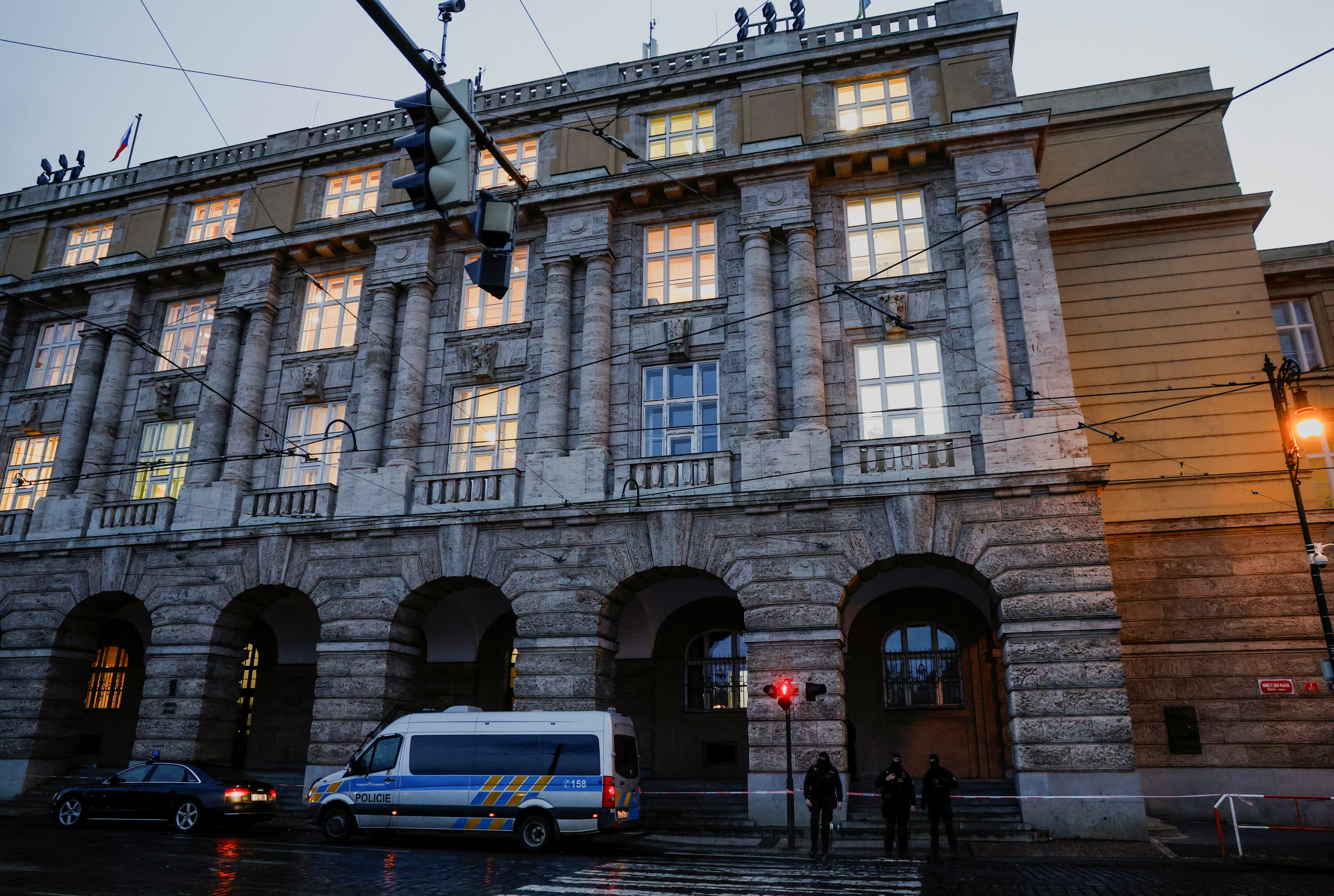 Members of the police stand guard following a shooting at one of Charles University's buildings in Prague
