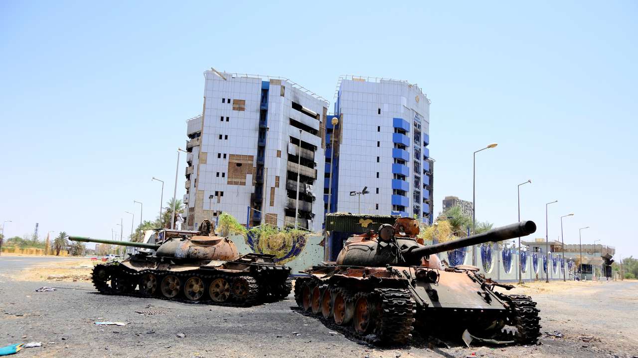 A view of damaged tanks in front of the Central Bank of Sudan building, in Khartoum