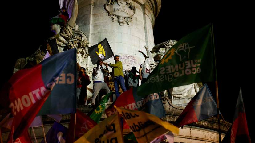 People gather on the Place de Republique following the results of the European elections, in Paris