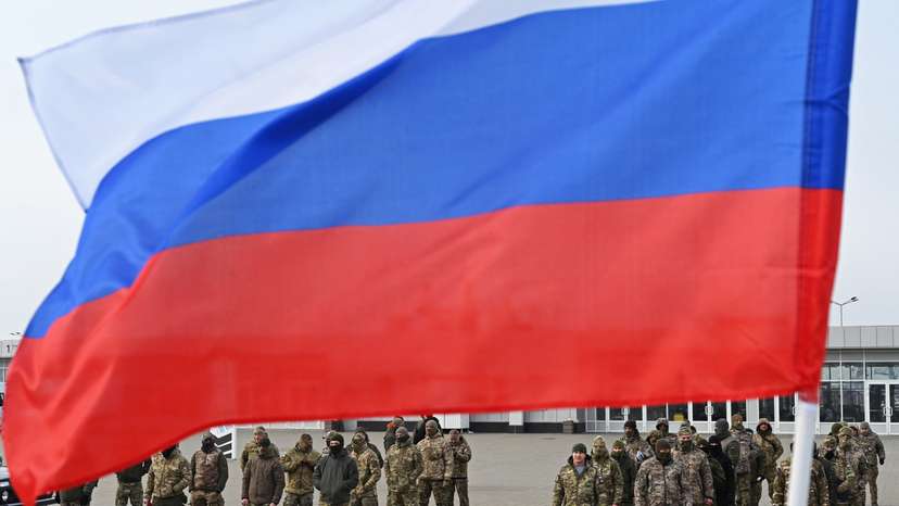 FILE PHOTO: Russian service members attend a ceremony to receive new vehicles and military equipment handed over by the Russian movement "People's Front" for the military involved in Russia-Ukraine conflict