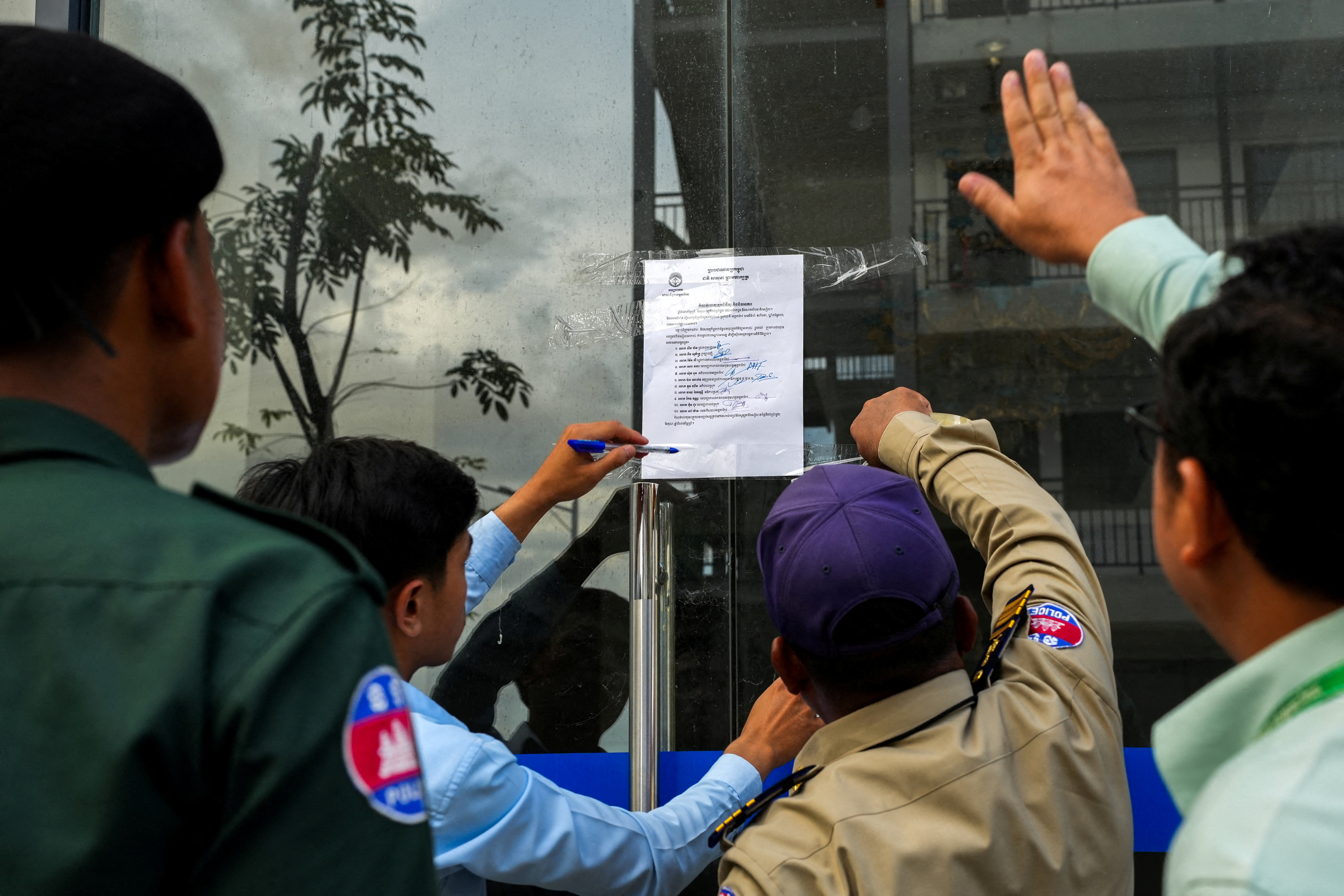 FILE PHOTO: Cambodian authorities inspect compound for South Koreans trapped in scam centres