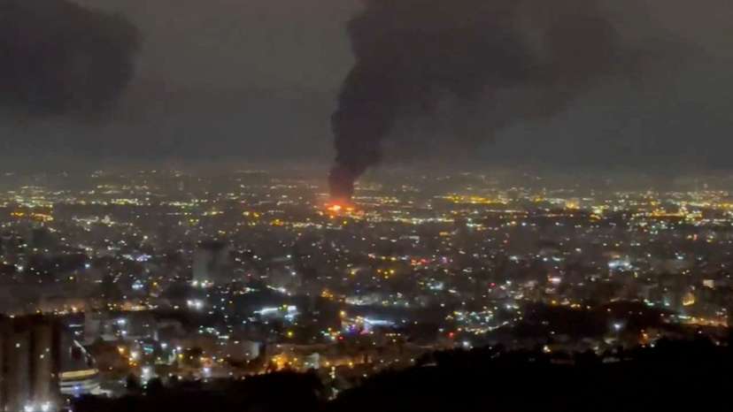 Smoke rises after air strikes, in Tehran