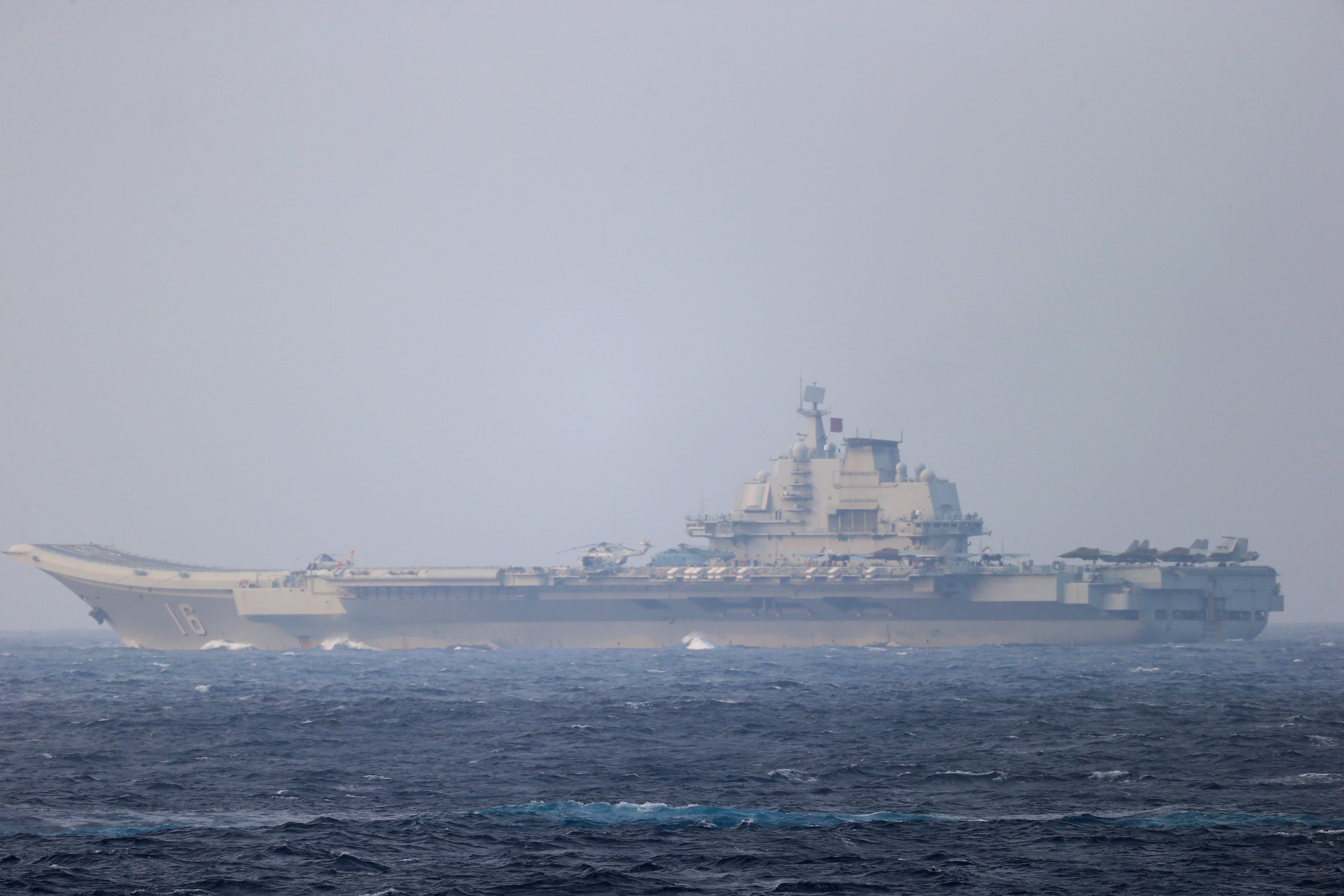 FILE PHOTO: Chinese aircraft carrier Liaoning sails through the Miyako Strait near Okinawa on its way to the Pacific in this handout photo