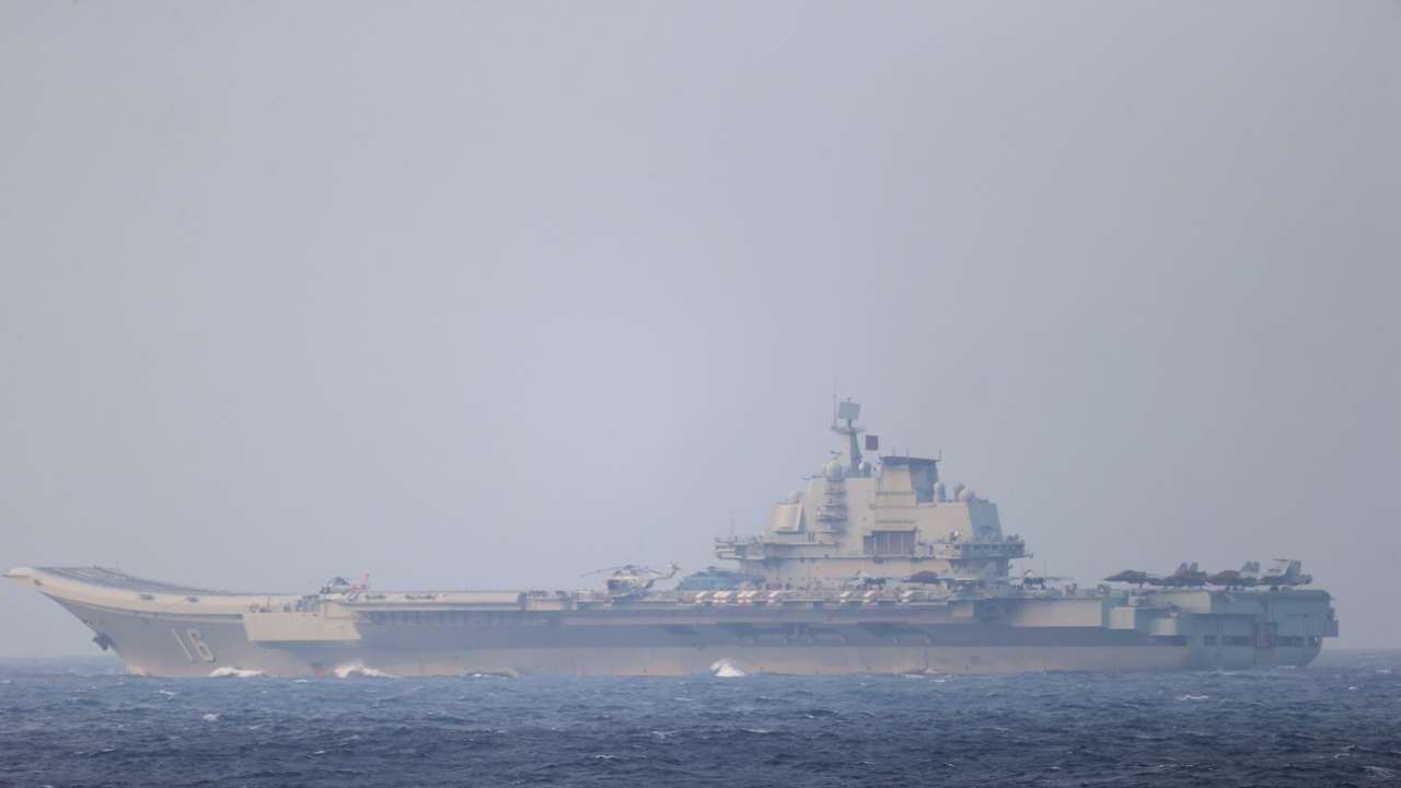 FILE PHOTO: Chinese aircraft carrier Liaoning sails through the Miyako Strait near Okinawa on its way to the Pacific in this handout photo