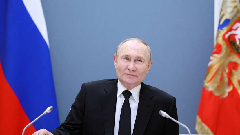 FILE PHOTO: Russian President Putin holds a meeting with large families from various Russia's regions via video link in Moscow