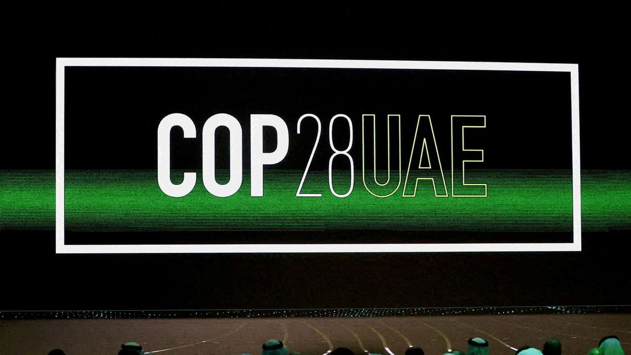 FILE PHOTO: 'Cop28 UAE' logo is displayed on the screen during the opening ceremony of Abu Dhabi Sustainability Week (ADSW) under the theme of 'United on Climate Action Toward COP28', in Abu Dhabi