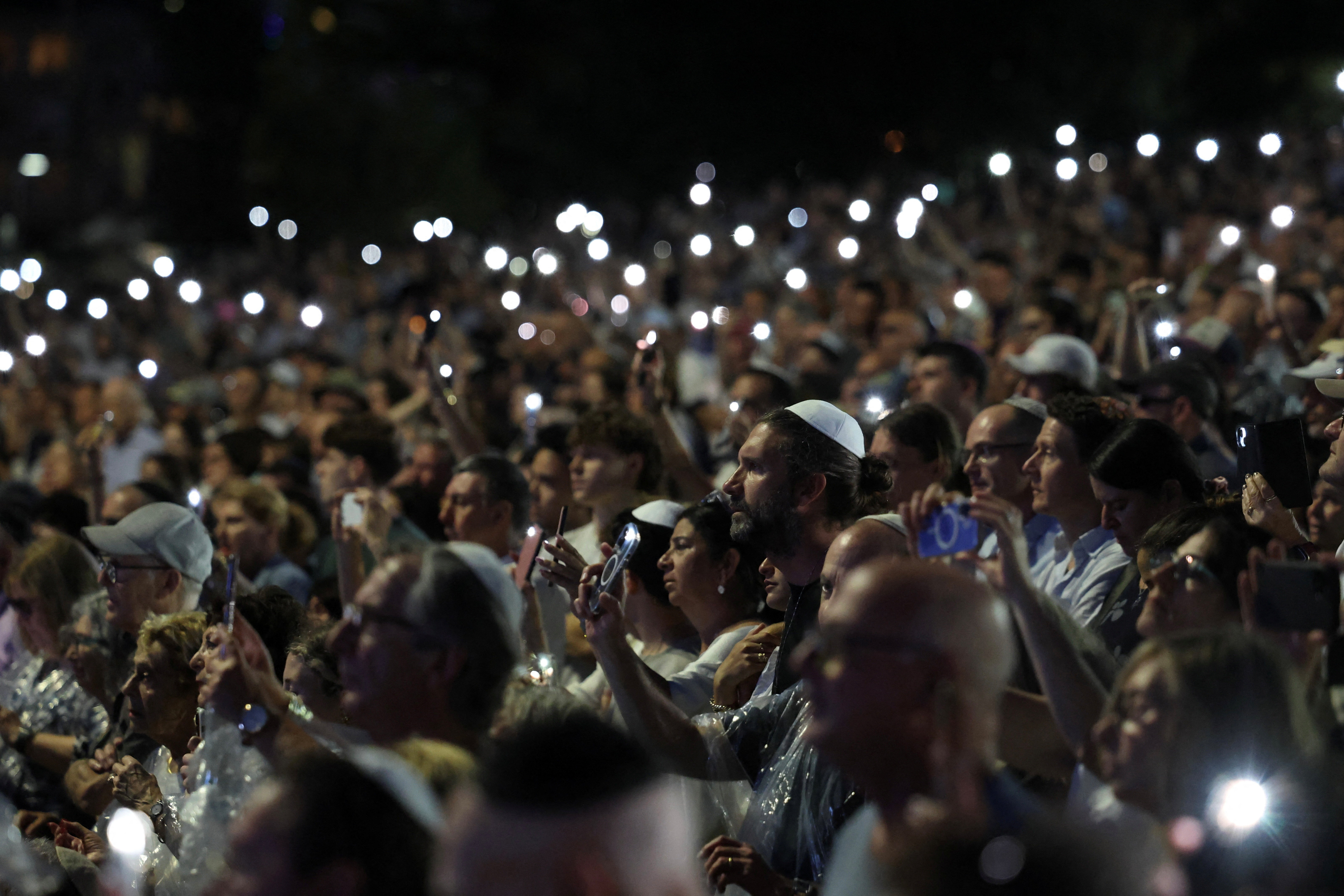 People attend the ‘Light Over Darkness’ vigil in Sydney