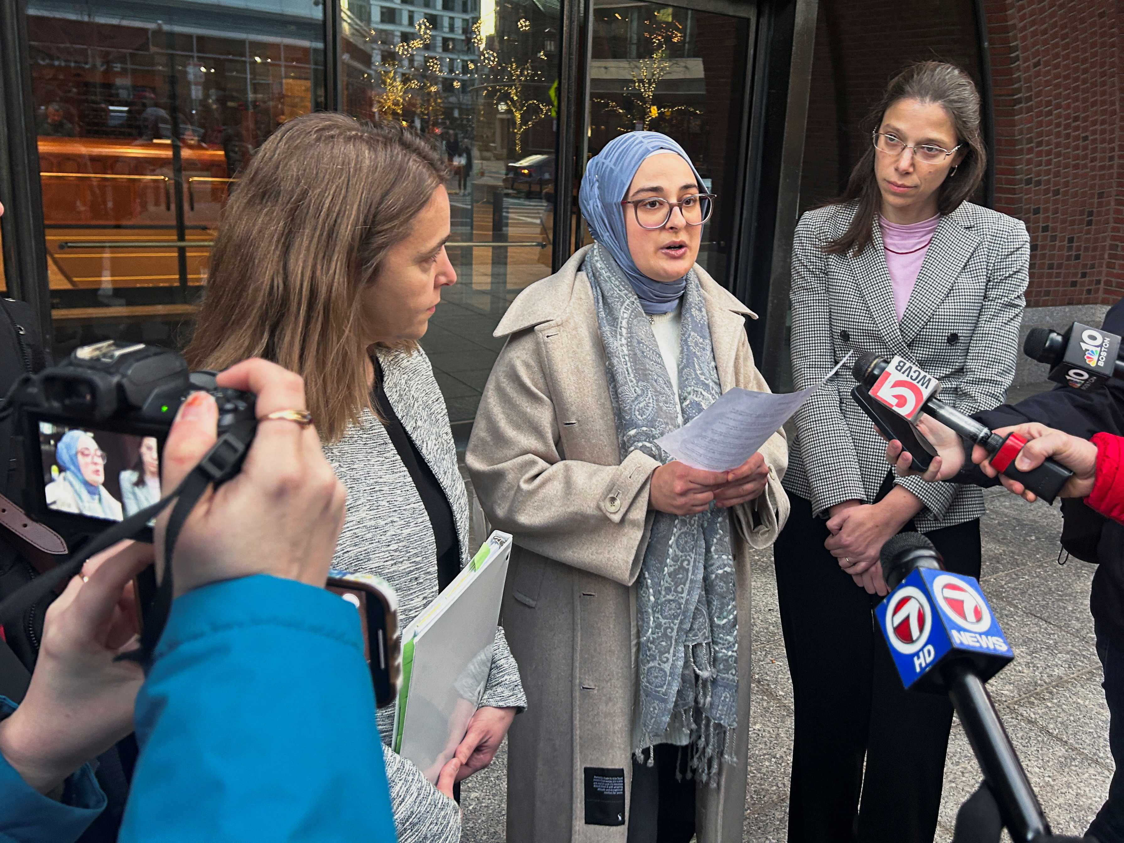 Rumeysa Ozturk, a Turkish student at Tufts University, speaks to reporters outside the federal court in Boston