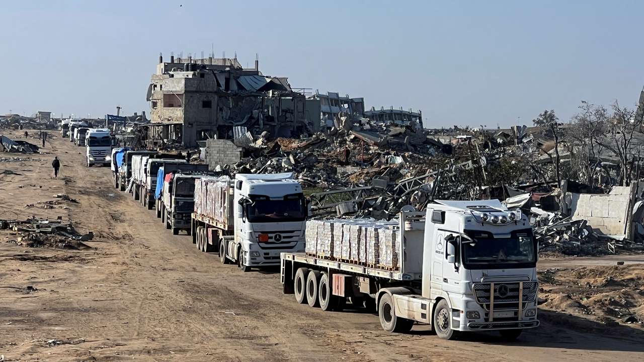 Trucks carrying aid move, amid a ceasefire between Israel and Hamas, in Rafah in the southern Gaza Strip