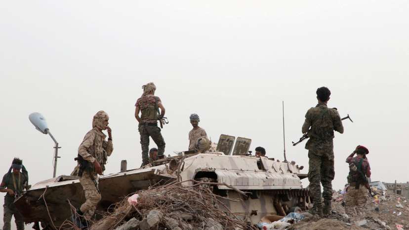 FILE PHOTO: Members of UAE-backed southern Yemeni separatist forces stand by a military vehicle during clashes with government forces in Aden