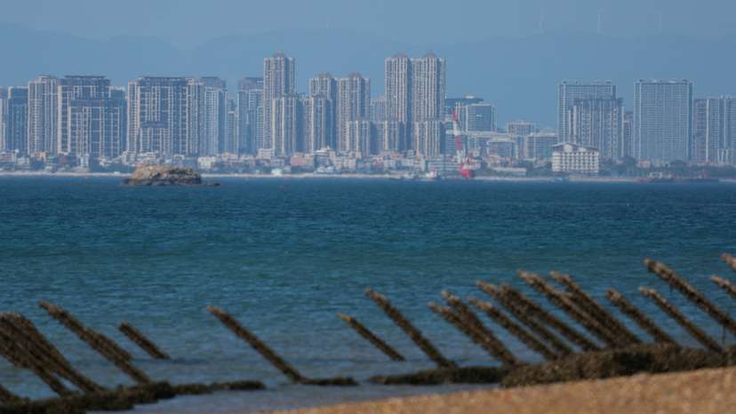 FILE PHOTO: Anti-landing barricades are pictured on the beach, with China's Xiamen city in the background, in Kinmen