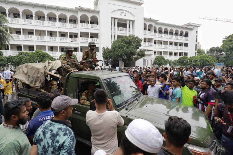 Protesters gather at the High Court premises demanding the resignation of Hassan, chief justice of Bangladesh in Dhaka