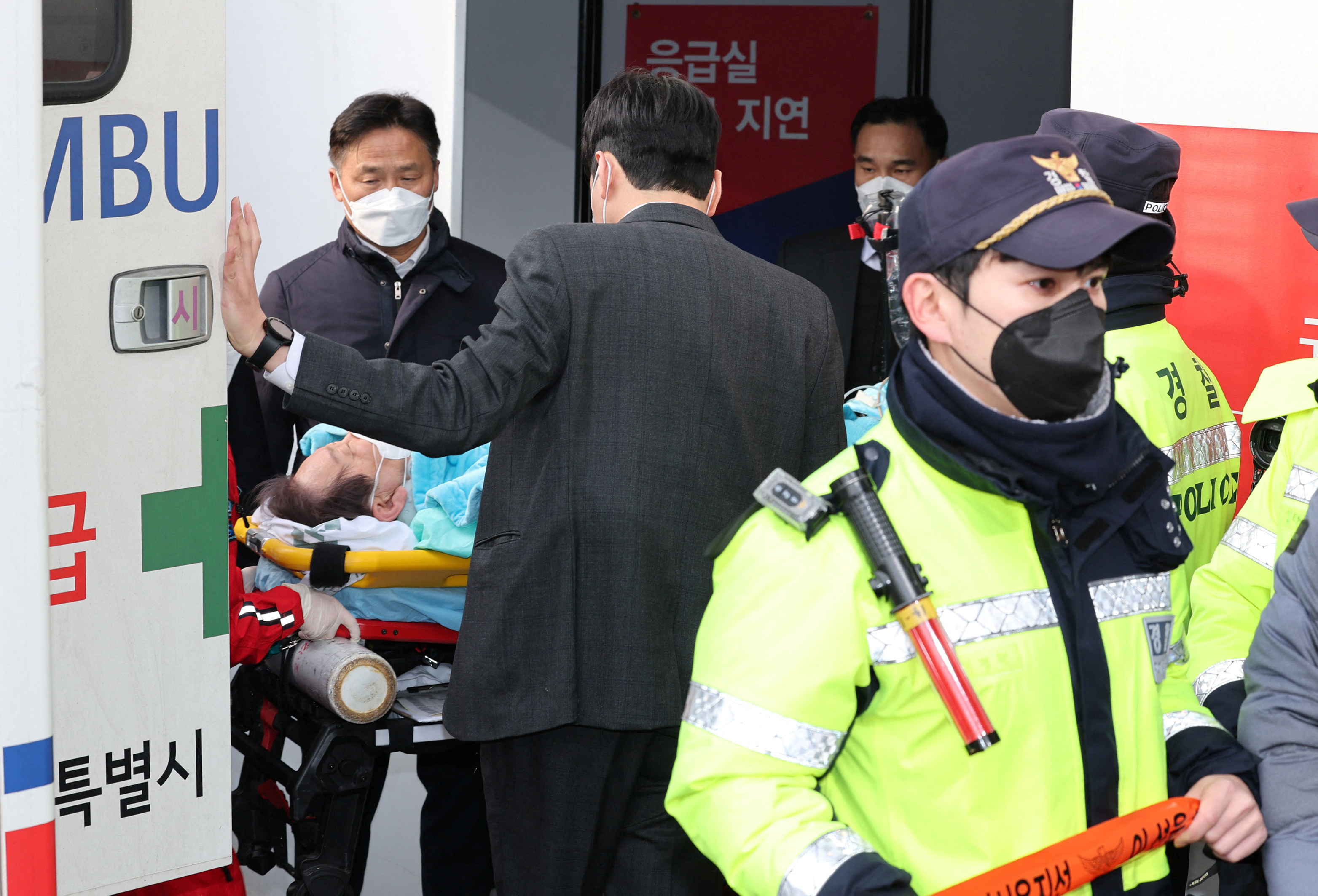 South Korea's opposition Democratic Party leader Lee Jae-myung arrives at Seoul National University Hospital after being stabbed in the neck during his visit to Busan, in Seoul