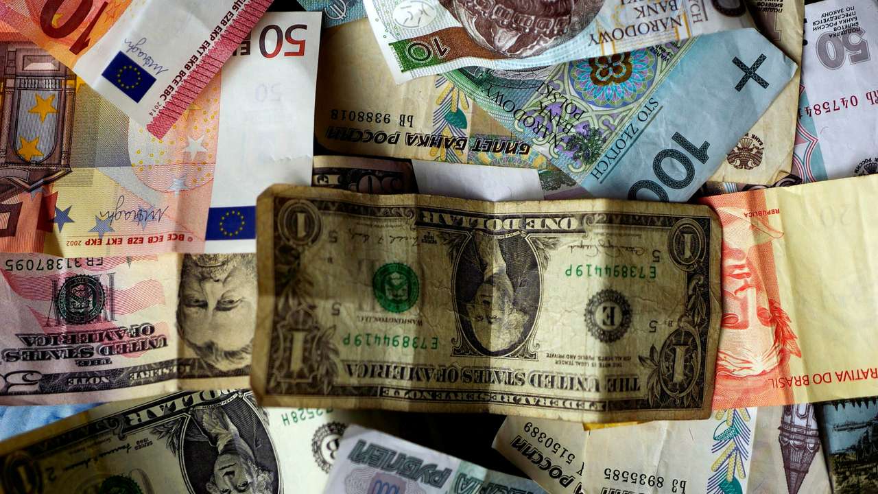 FILE PHOTO: Bank notes of different currencies are photographed in Frankfurt, Germany, in this illustration picture