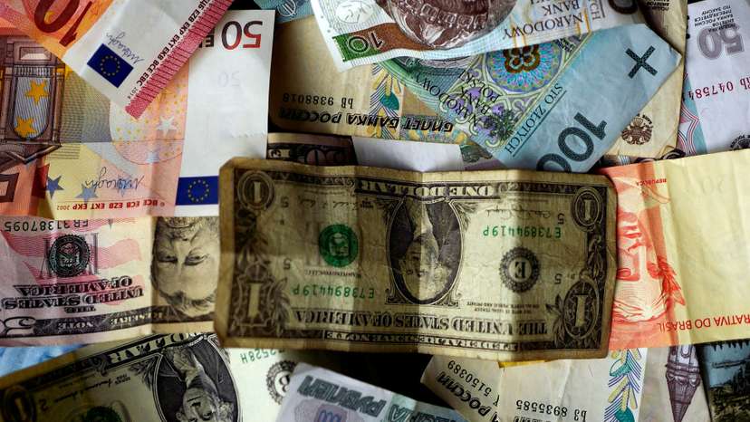 FILE PHOTO: Bank notes of different currencies are photographed in Frankfurt, Germany, in this illustration picture