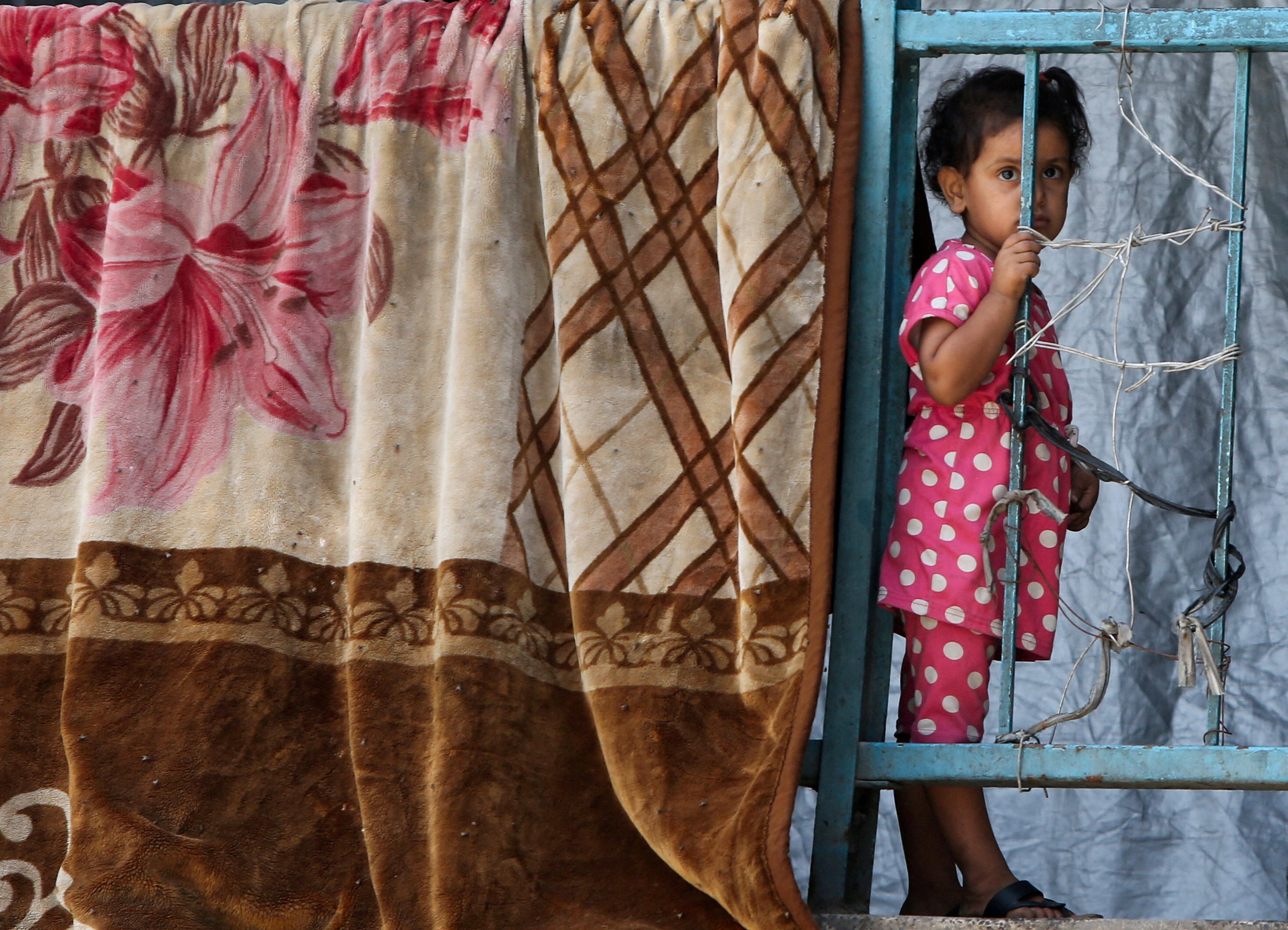 Palestinians displaced by the Israeli military offensive shelter in an UNRWA school, in Khan Younis