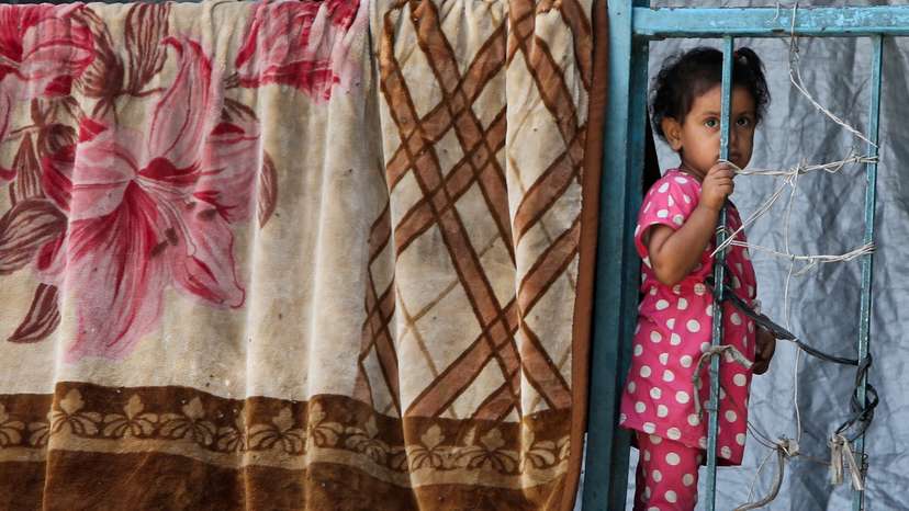 Palestinians displaced by the Israeli military offensive shelter in an UNRWA school, in Khan Younis