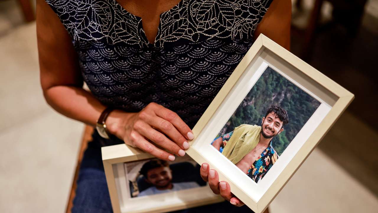 Rachel Goldberg, U.S.-Israeli mother of Hersh Goldberg Polin, which was taken hostage by Hamas militants into the Gaza Strip holds photos of her son, in Jerusalem