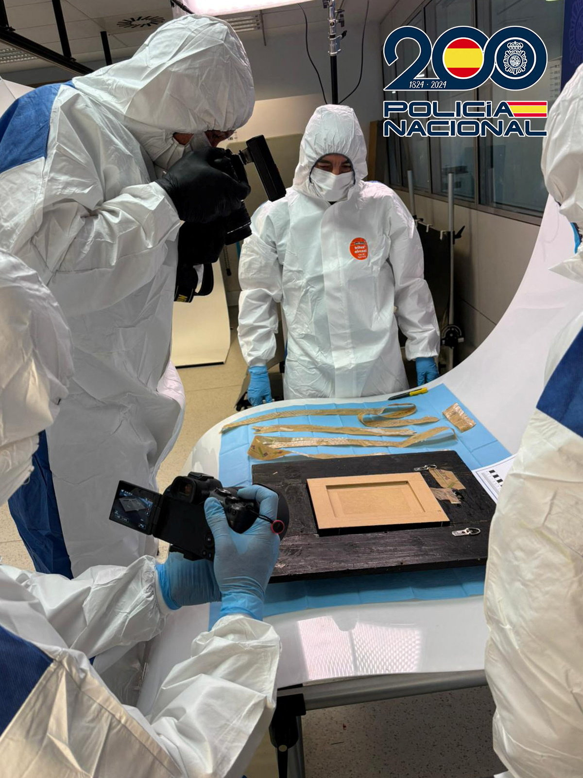 Spanish National Police inspect a Picasso painting "Still Life with Guitar\