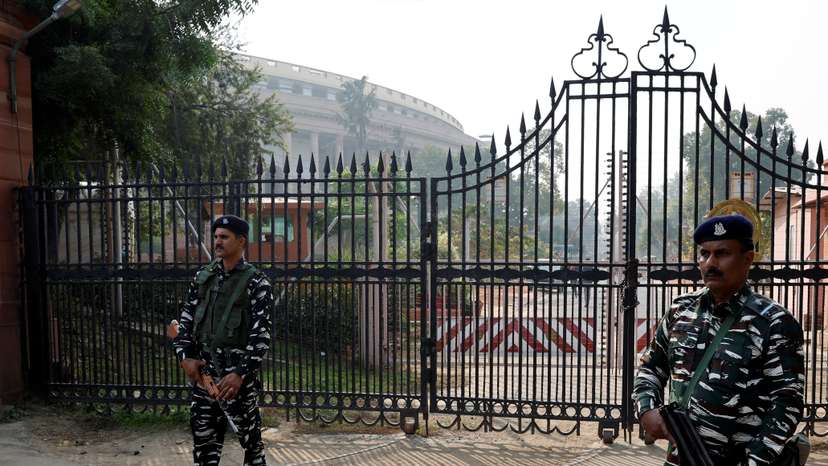 Security force personnel stand guard outside the parliament premises, in New Delhi