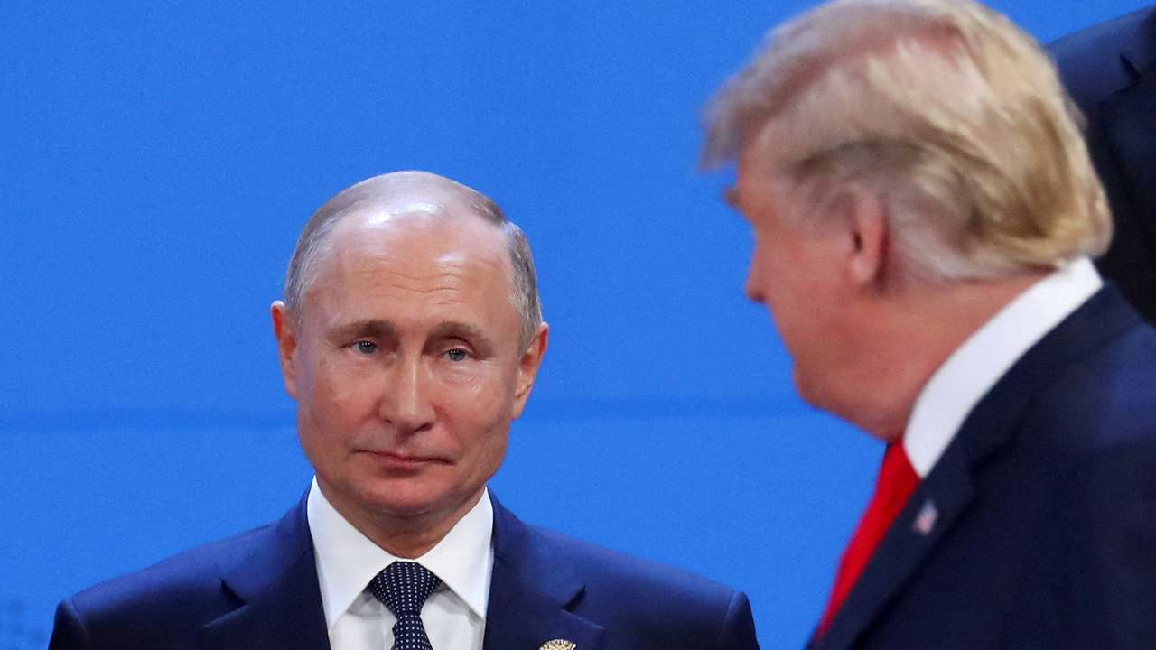 FILE PHOTO: Putin and Trump are pictured in 2018 in Argentina
