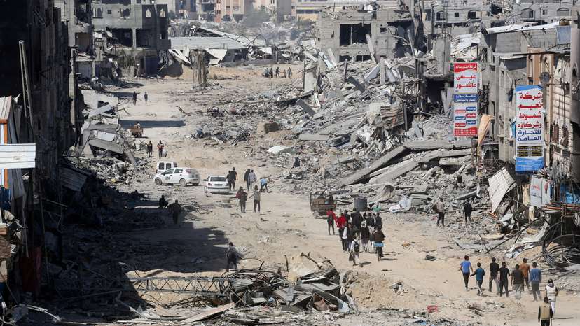 Palestinians inspect destroyed residential buildings in Khan Younis