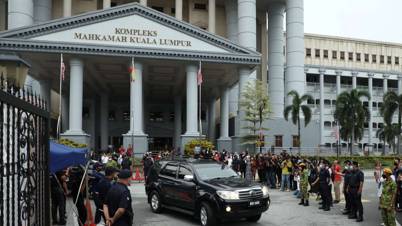Former Malaysian Prime Minister Najib Razak leaves in a vehicle from Kuala Lumpur Court Complex in Kuala Lumpur