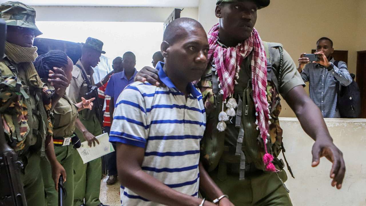 FILE PHOTO: Paul Mackenzie, a Kenyan cult leader accused of ordering his followers, who were members of the Good News International Church, to starve themselves to death in Shakahola forest, is escorted to the Malindi Law Courts