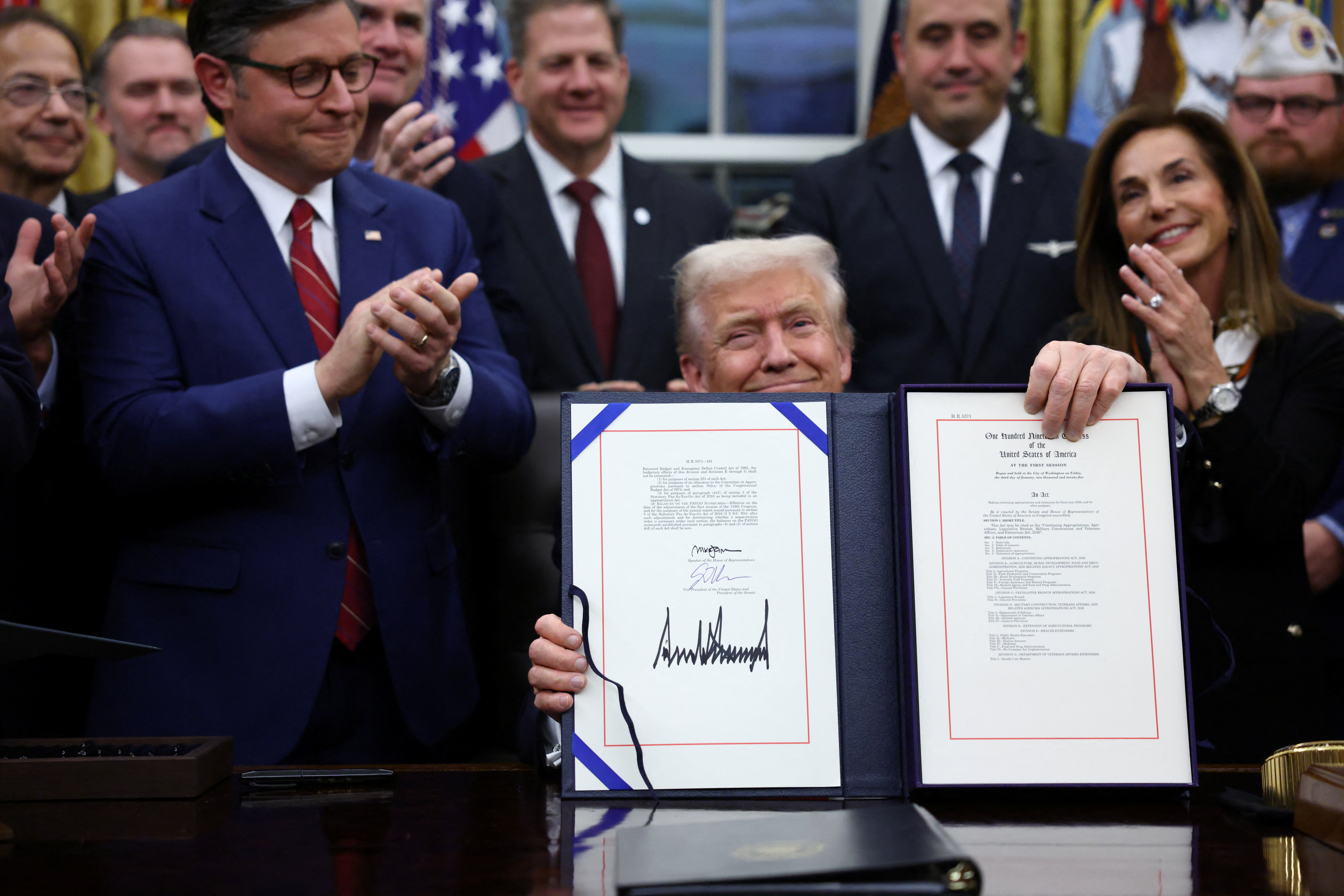 U.S. President Trump signs the funding bill to end the government shutdown, in Washington, D.C.