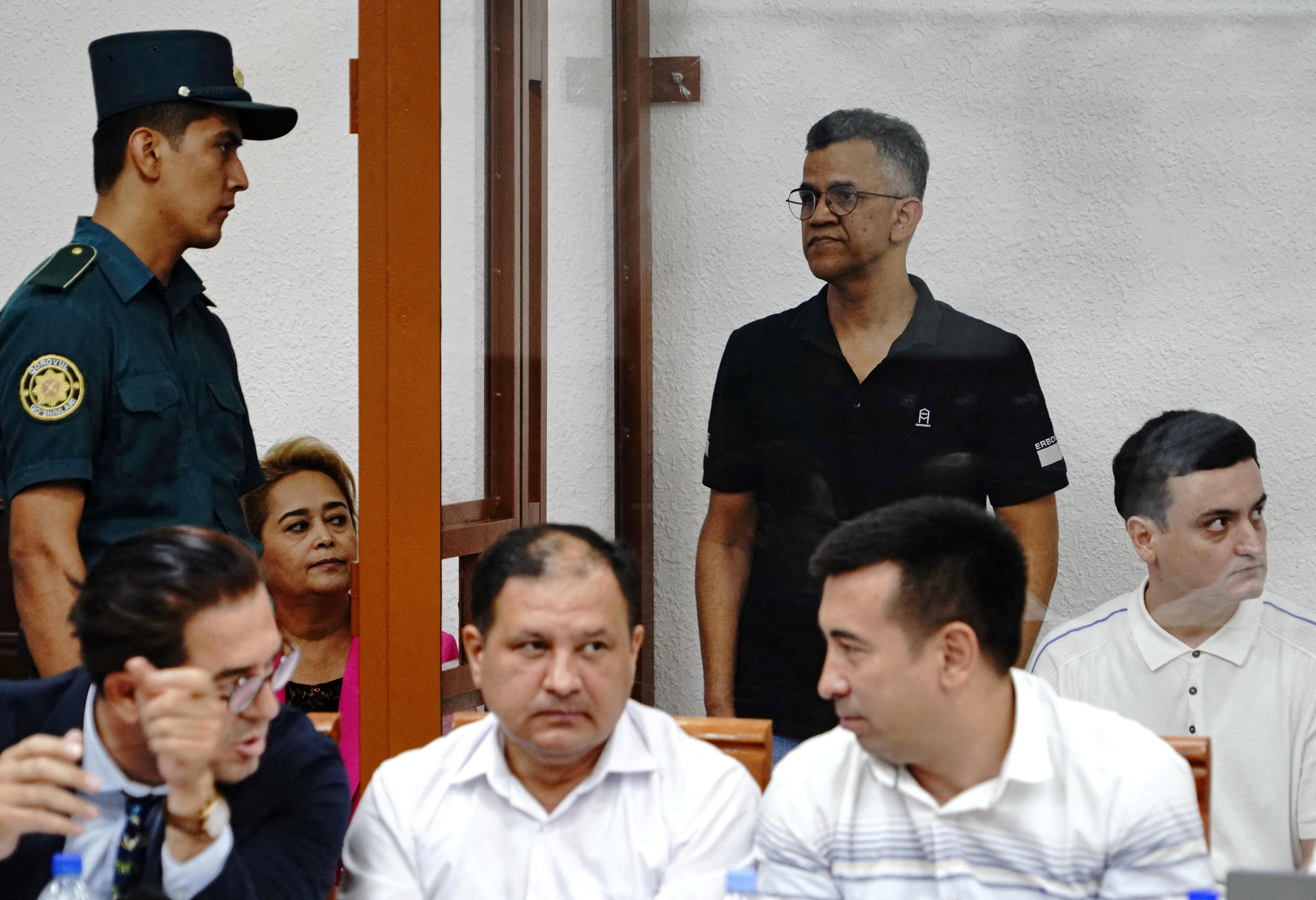 FILE PHOTO: Defendants and lawyers attend a court hearing in the case of child deaths linked to contaminated cough syrups, in Tashkent