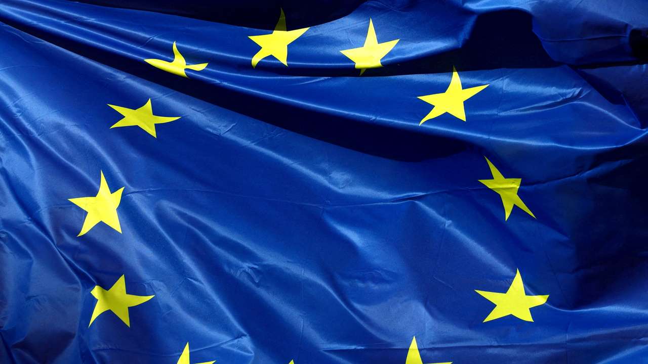 FILE PHOTO: A European Union flag flutters outside the EU Commission headquarters in Brussels