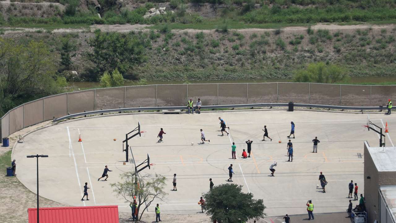 FILE PHOTO: Migrant boys spend time in a recreation area outside Casa Padre, an immigrant shelter for unaccompanied minors, in Brownsville