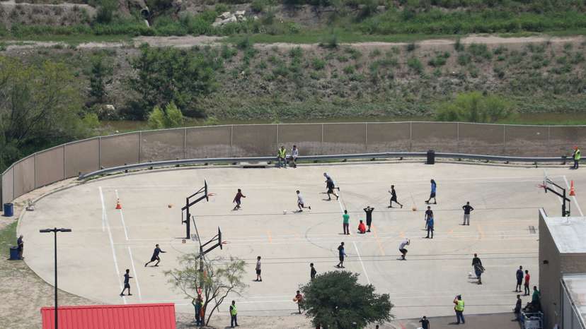 FILE PHOTO: Migrant boys spend time in a recreation area outside Casa Padre, an immigrant shelter for unaccompanied minors, in Brownsville