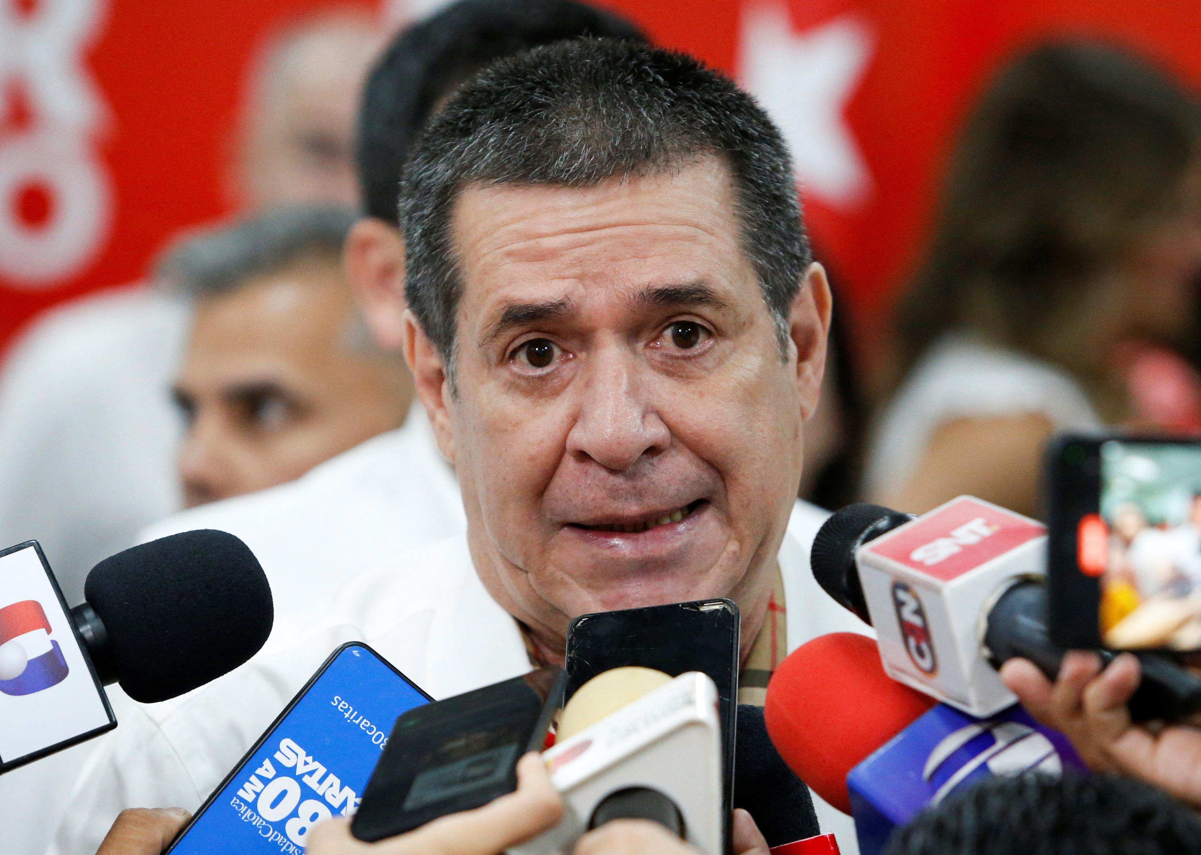 Presidential pre-candidates attend a primary election at a poll station, in Asuncion