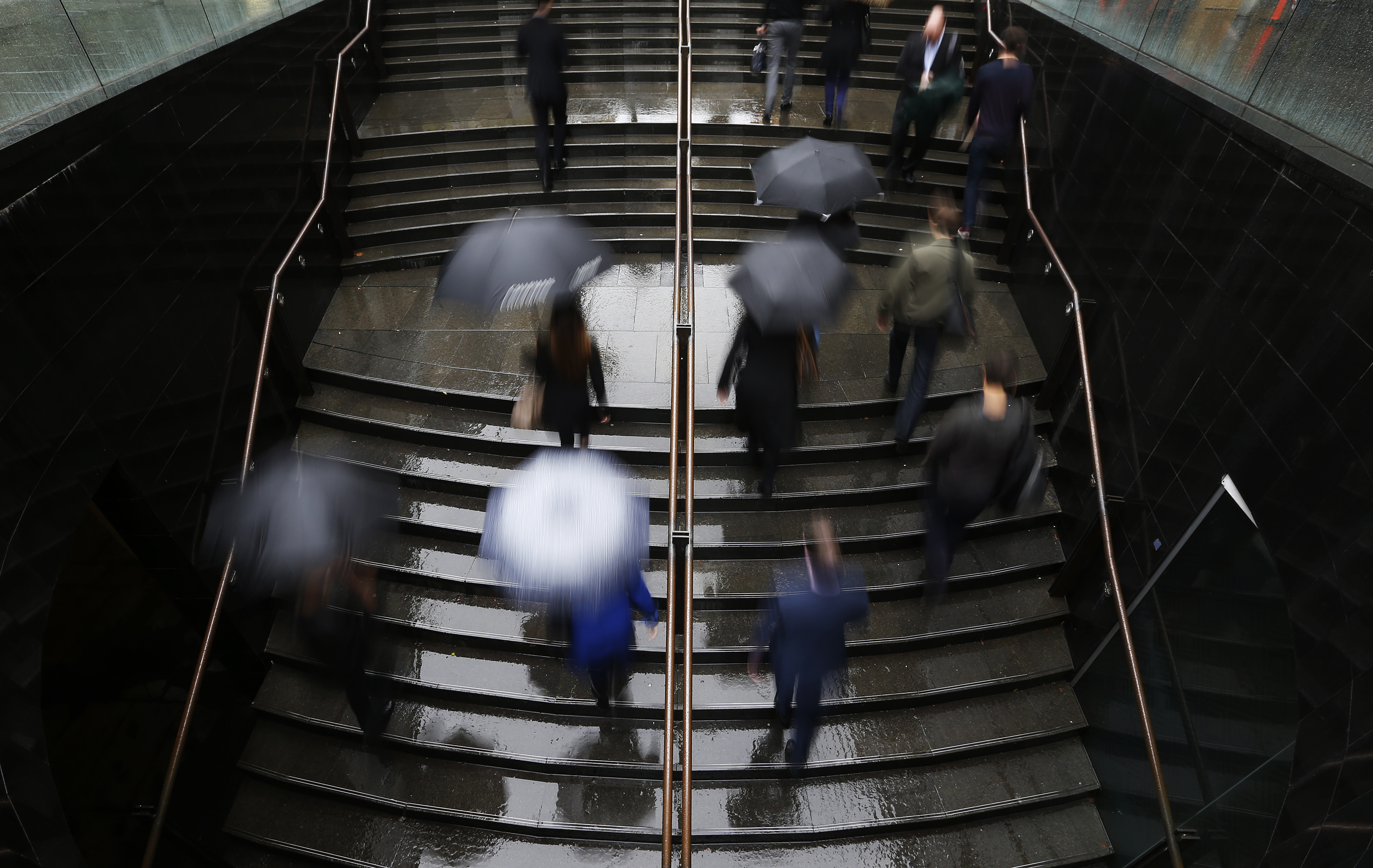 Commuters arrive to the Central Business District at the morning rush hour in Sydney