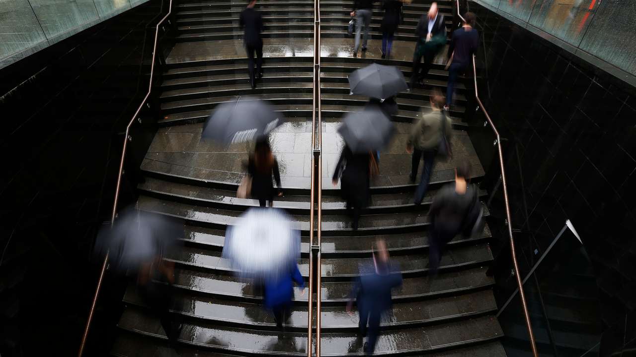 Commuters arrive to the Central Business District at the morning rush hour in Sydney