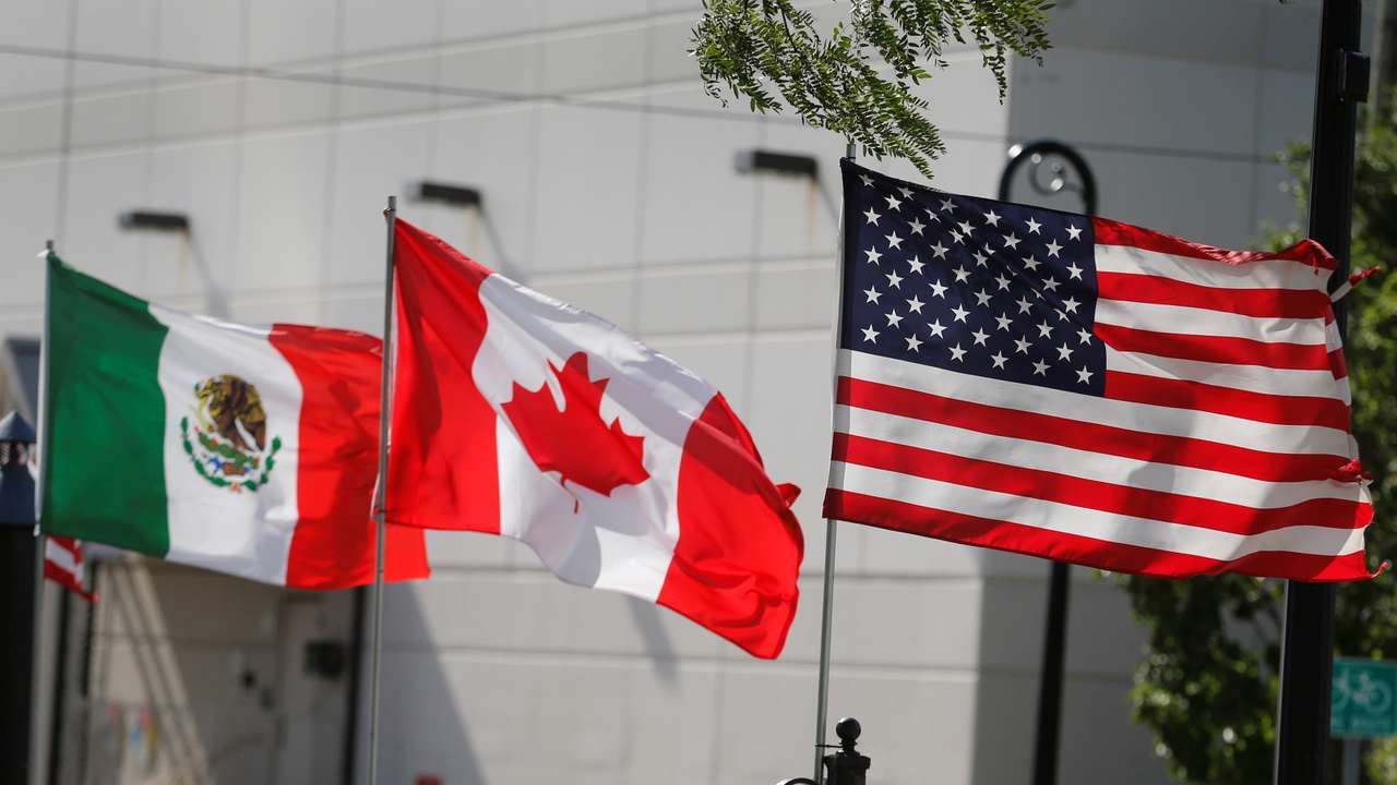 Flags of the U.S., Canada and Mexico fly next to each other in Detroit, Michigan